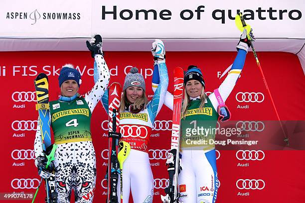 Mikaela Shiffrin of the United States celebrates on the podium after winning the slalom along with Veronika Velez Zuzulova of Slovakia in second...