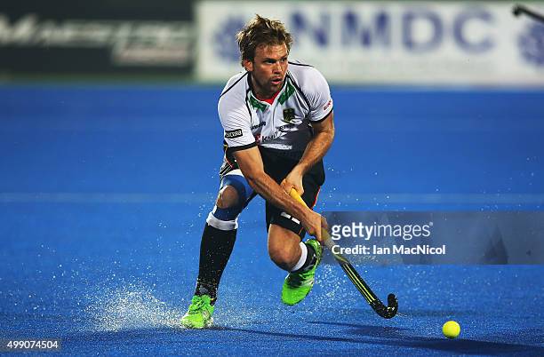 Moritz Furste of Germany runs with the ball during the match between India and Germany on day two of The Hero Hockey League World Final at the Sardar...