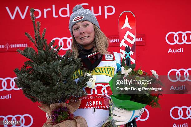 Mikaela Shiffrin of the United States celebrates on the podium with her prizes after winning the slalom during the Audi FIS Women's Alpine Ski World...