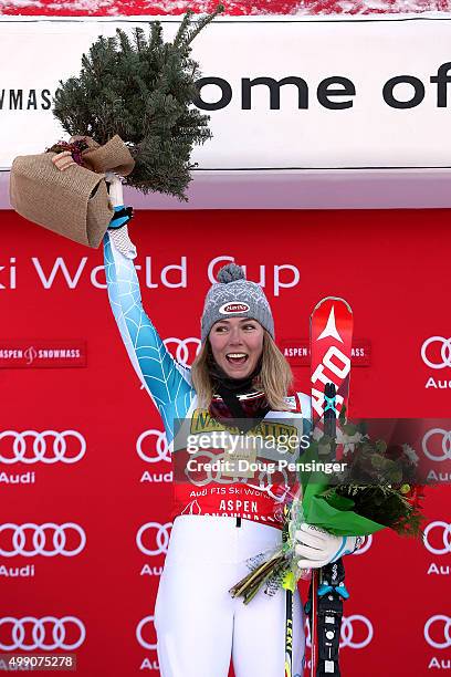 Mikaela Shiffrin of the United States celebrates on the podium with her prizes after winning the slalom during the Audi FIS Women's Alpine Ski World...