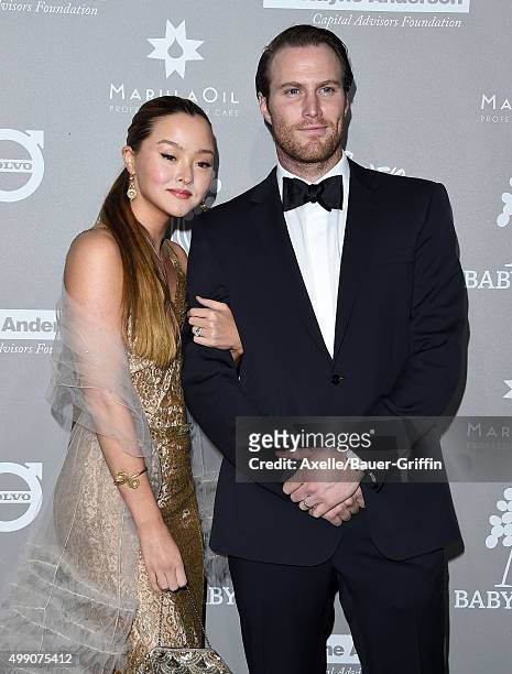 Actress Devon Aoki and James Bailey attend the 2015 Baby2Baby Gala at 3LABS on November 14, 2015 in Culver City, California.
