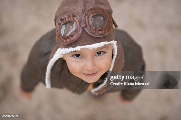 beautiful boy with an aviator hat - aviator glasses stock pictures, royalty-free photos & images