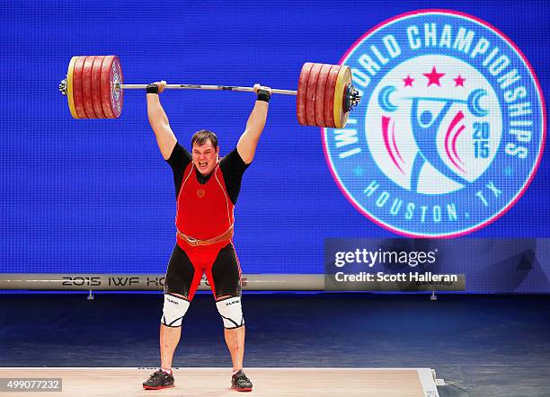 Aleksei Lovchev of Russia lifts a world record 264kg in the clean and jerk in the men's +105kg weight class during the 2015 International...