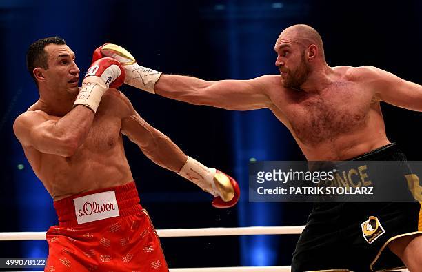 World heavyweight boxing champion Wladimir Klitschko of Ukraine defends against Britain's Tyson Fury during their WBA, IBF, WBO and IBO title bout in...