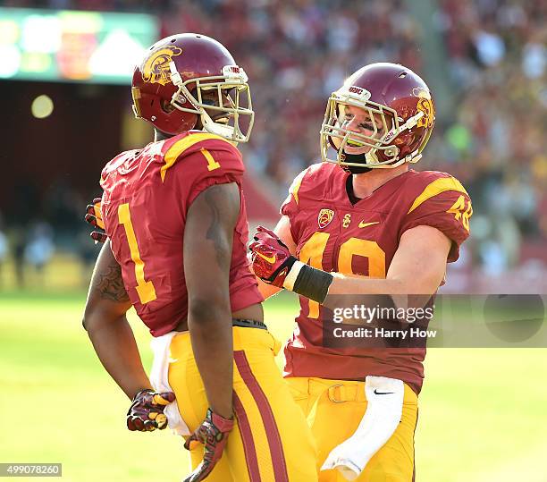 Darreus Rogers of the USC Trojans celebrates his touchdown with Taylor McNamara to take a 33-21 lead over the UCLA Bruins during the third quarter at...