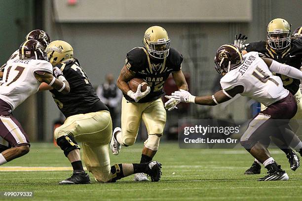 Running back Elijhaa Penny of the Idaho Vandals rushes during first half action between the Texas State Bobcats and the Idaho Vandals on November 28,...