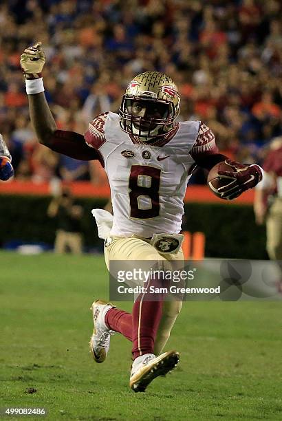 Kermit Whitfield of the Florida State Seminoles runs for yardage during the game against the Florida Gators at Ben Hill Griffin Stadium on November...
