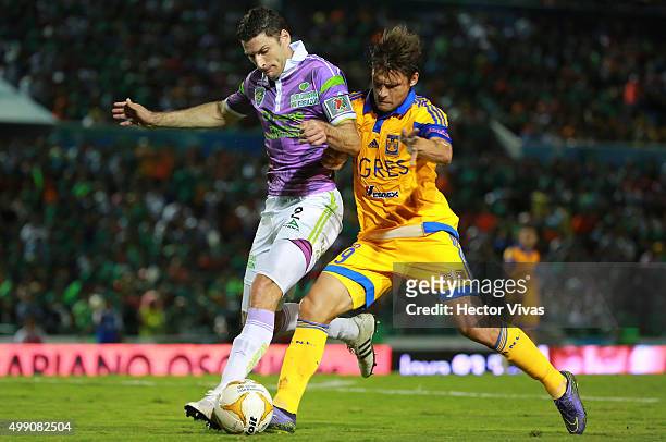 Rafael Sobis of Tigres struggles for the ball with Javier Munoz of Chiapas during the quarterfinals second leg match between Chiapas and Tigres UANL...