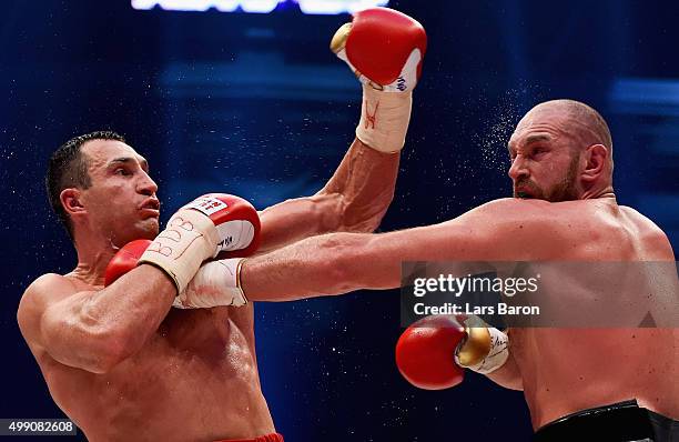 Tyson Fury in action with Wladimir Klitschko during their IBF/IBO/WBA/WBO World Heavyweight Championship title fight at Esprit-Arena on November 28,...