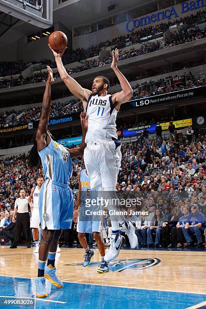 JaVale McGee of the Dallas Mavericks grabs a rebound against the Denver Nuggets on November 28, 2015 at the American Airlines Center in Dallas,...