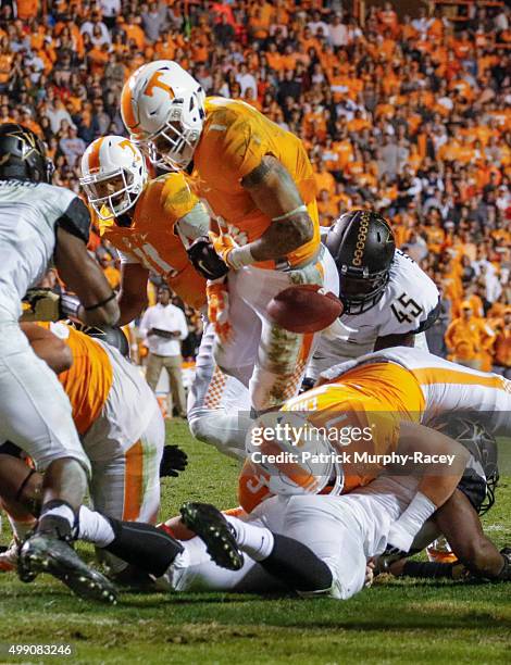 Stephen Weatherly of the Vanderbilt Commodores causes Jalen Hurd of the Tennessee Volunteers to fumble the ball in a game at Neyland Stadium on...
