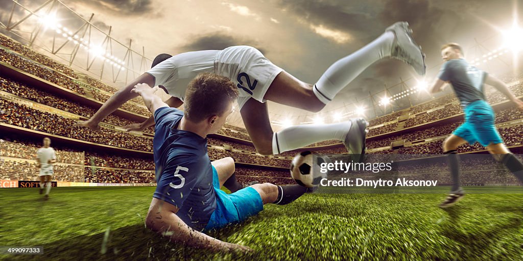 Soccer stadium and soccer players in action