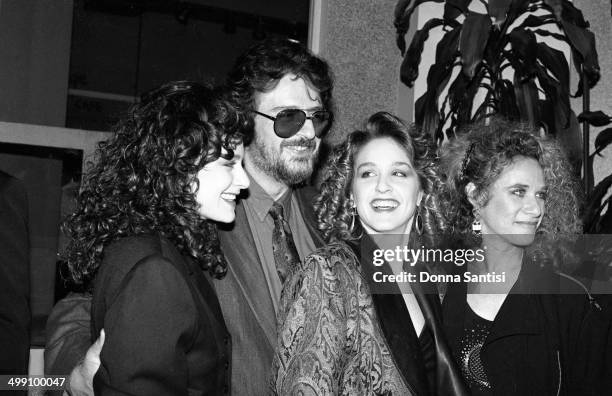 American songwriters Gerry Goffin and Carole King pose with their daughters Louise Goffin and Sherry Goffin Kondor, backstage at a Songwriters'...