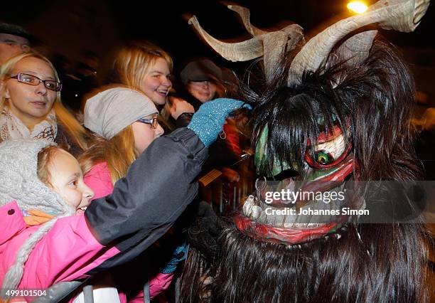 Participants dressed as the Krampus creature walk the streets in search of delinquent children during a Krampus run on November 28, 2015 in Salzburg,...