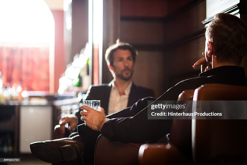Two men sitting in a bar