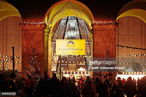Visitors arrive for a walk among stalls at the annual Christmas market at Domplatz on its opening day on November 28, 2015 in Salzburg, Austria.