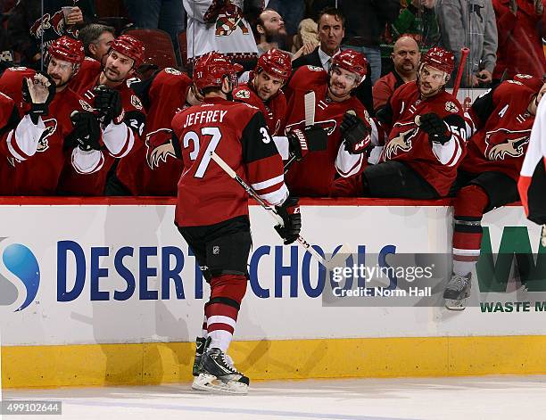 Dustin Jeffrey of the Arizona Coyotes is congratulated by teammates after his second period goal against the Ottawa Senators at Gila River Arena on...