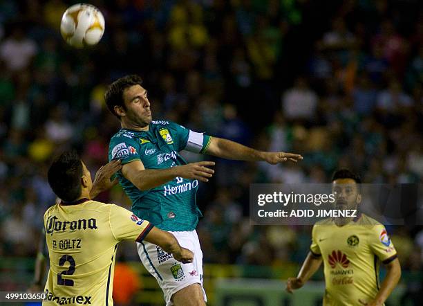 Mauro Boselli of Leon vies for the ball with Paolo Goltz of America, during their Mexican Apertura tournament football match at the Nou Camp stadium...