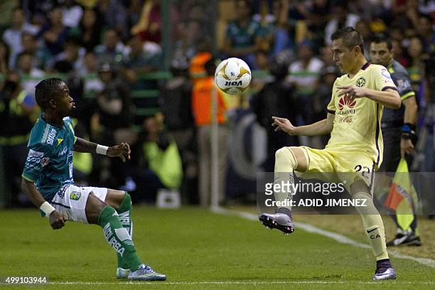 Dario Burbano of Leon vies for the ball with Paul Aguilar of America, during their Mexican Apertura tournament football match at the Nou Camp stadium...