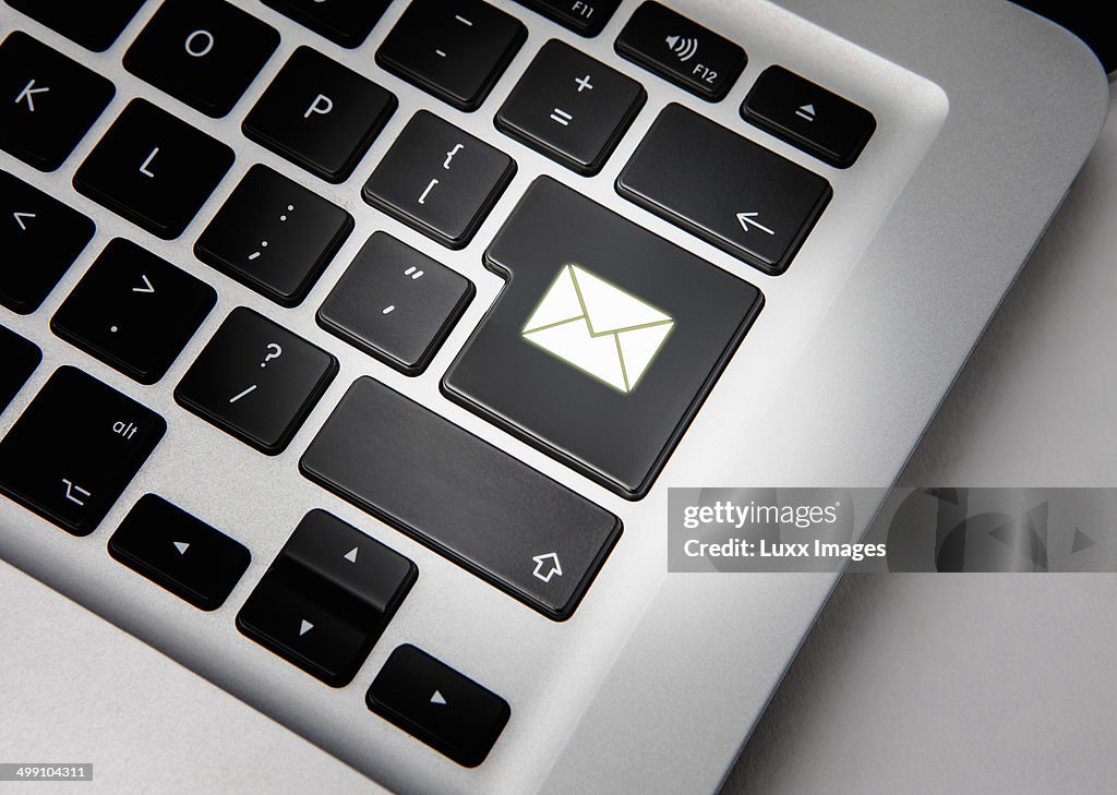 Close up of computer with email sign on enter key