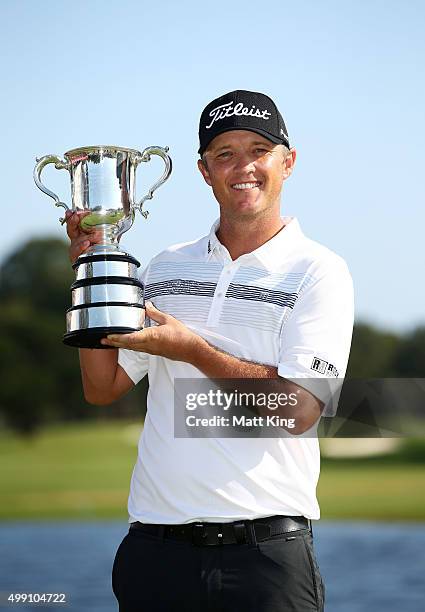 Matt Jones of Australia poses with the Stonehaven trophy after winning the 2015 Australian Open during day four of the Australian Open at The...