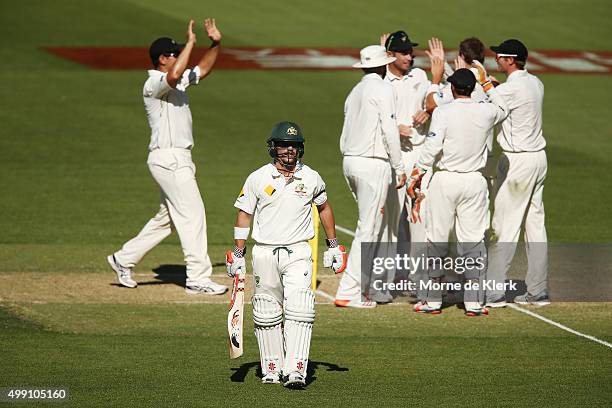 David Warner of Australia leaves the field after getting out to Doug Bracewell of New Zealand during day three of the Third Test match between...