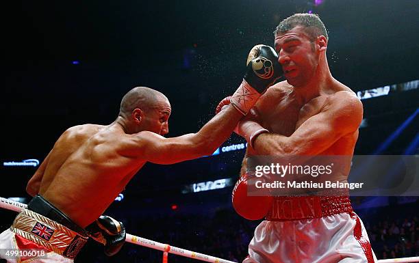 James Degale of England throws a punch to Lucian Bute of Canada during their IBF super-middleweight championship fight at the Centre Videotron on...