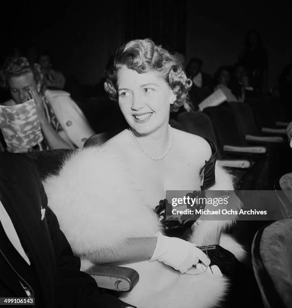 Actress Mary Cummings attends a premiere with her husband Robert Cummings in Los Angeles, California.