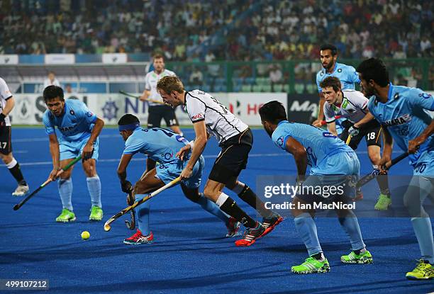 Niklas Wellen of Germany vies with Birendra Lakra of India during the match between Germany and India on day two of The Hero Hockey League World...