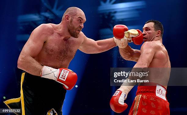 Tyson Fury in action with Wladimir Klitschko during their IBF/IBO/WBA/WBO World Heavyweight Championship title fight at Esprit-Arena on November 28,...