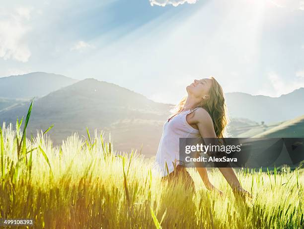 young woman outdoor enjoying the sunlight - women prayer 個照片及圖片檔