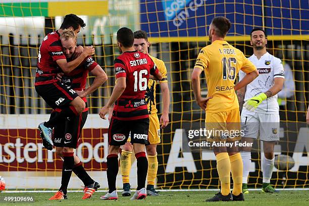 Wanderers team mates celebrate a goal by Mitch Nichols during the round eight A-League match between the Central Coast Mariners and the Western...