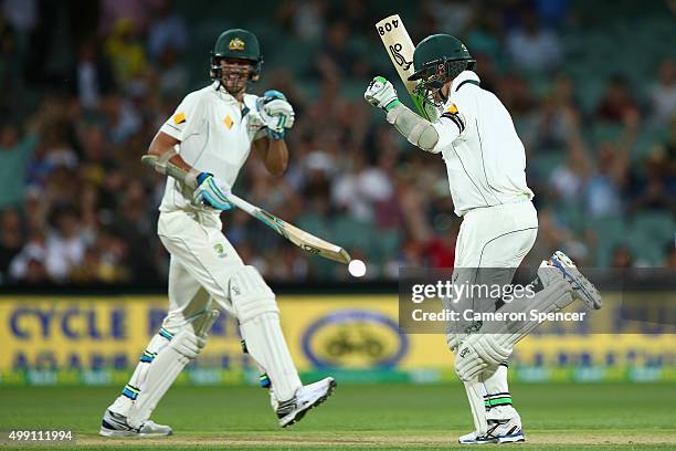 Peter Siddle of Australia celebrates after hitting the winning runs with team mate Mitchell Starc during day three of the Third Test match between...