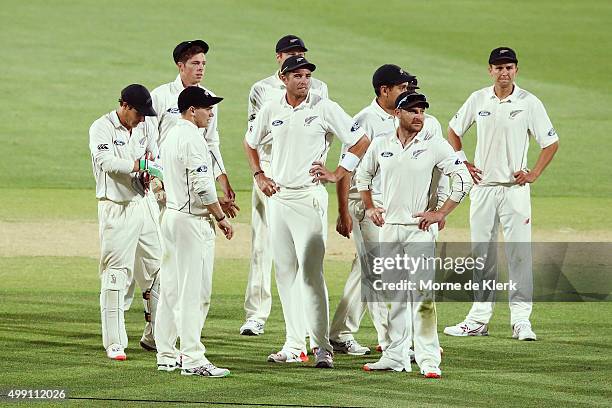 Players of New Zealand look on after the end of the match on day three of the Third Test match between Australia and New Zealand at Adelaide Oval on...