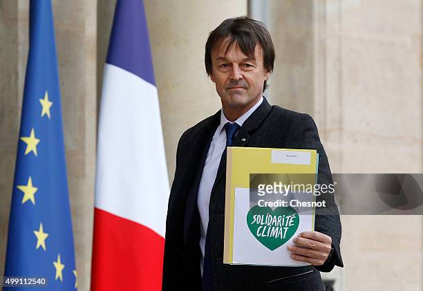 French environmental activist Nicolas Hulot arrives to attend a meeting with French President Francois Hollande at the Elysee Presidential Palace on...