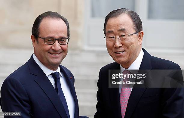 French President Francois Hollande welcomes United Nations Secretary-General Ban Ki-moon prior to attend a meeting at the Elysee Presidential Palace...