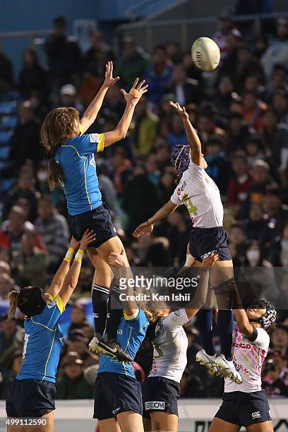 Teryayeva Olessya of Kazakhstan and Chisato Yoko of Japan compete for the lineout ball during the World Sevens Asia Olympic Qualification match...