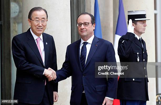 French President Francois Hollande welcomes United Nations Secretary-General Ban Ki-moon prior to attend a meeting at the Elysee Presidential Palace...