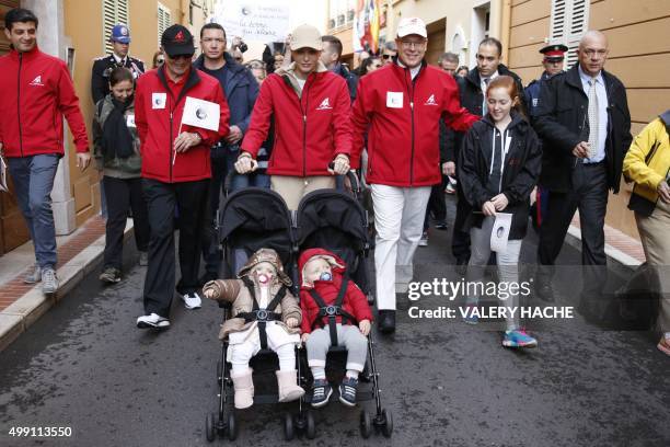 The twin children of the Prince and Princess of Monaco, Prince Jacques and Princess Gabriella, are pictured as their parents take part in a "March...