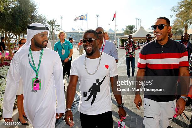 Kevin Hart and Ludacris walk in the paddock before the Abu Dhabi Formula One Grand Prix at Yas Marina Circuit on November 29, 2015 in Abu Dhabi,...