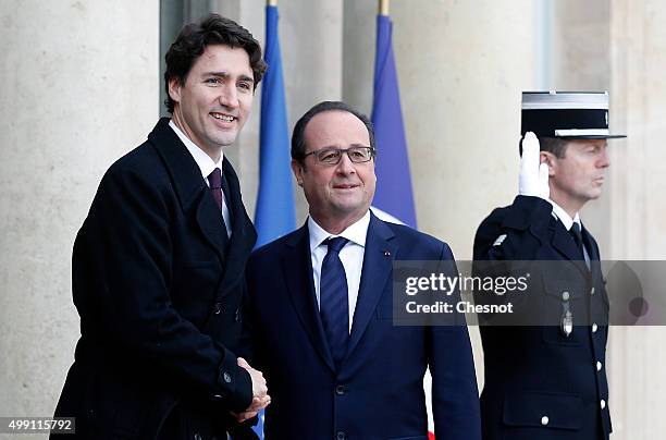 French President Francois Hollande welcomes Canadian Prime Minister, Justin Trudeau prior to attending a meeting at the Elysee Presidential Palace on...