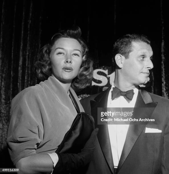 Actress Gloria Grahame with Cy Howard attends a party in Los Angeles, California.