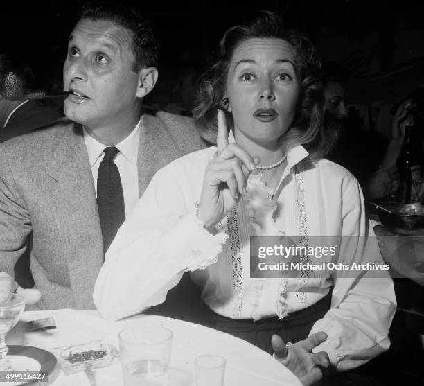 Actress Gloria Grahame with Cy Howard attends a party in Los Angeles, California.