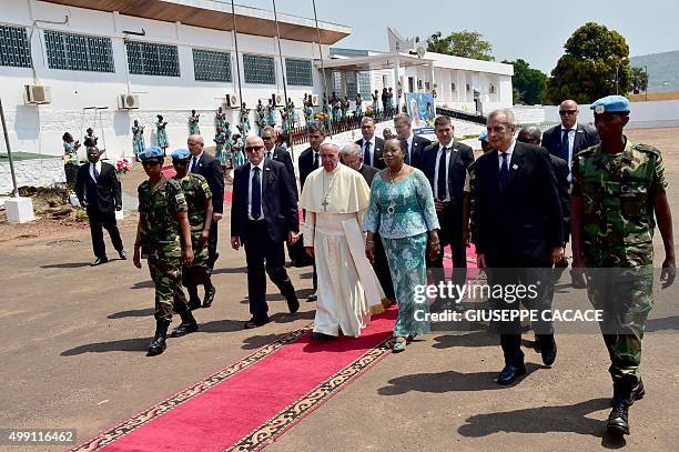 Pope Francis and interim leader of the Central African Republic, Catherine Samba Panza arrive at the State House in Bangui on November 29, 2015. Pope...