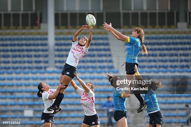 Makiko Tomita of Japan and Teryayeva Olessya of Kazakhstan compete for the lineout ball during the World Sevens Asia Olympic Qualification match...