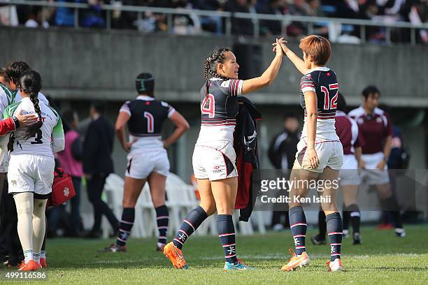 Christy Cheng Ka Chi and Aggie Poon Pak Yan of Hong Kong celebrate after winning the World Sevens Asia Olympic Qualification match between Hong Kong...