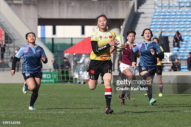 Sun Shichao of China runs in to score the World Sevens Asia Olympic Qualification match between China and Guam at Prince Chichibu Stadium on November...