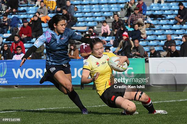 Zhang Wanting of China runs in to score the World Sevens Asia Olympic Qualification match between China and Guam at Prince Chichibu Stadium on...