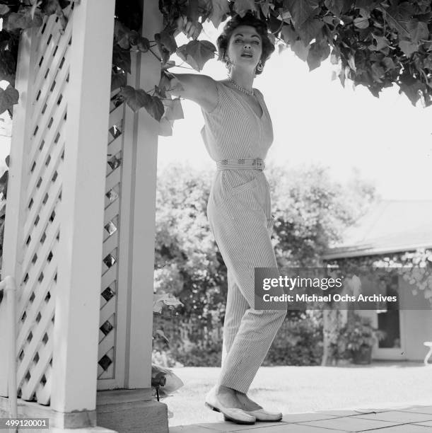 Actress Yvonne De Carlo poses at home in Los Angeles, California.