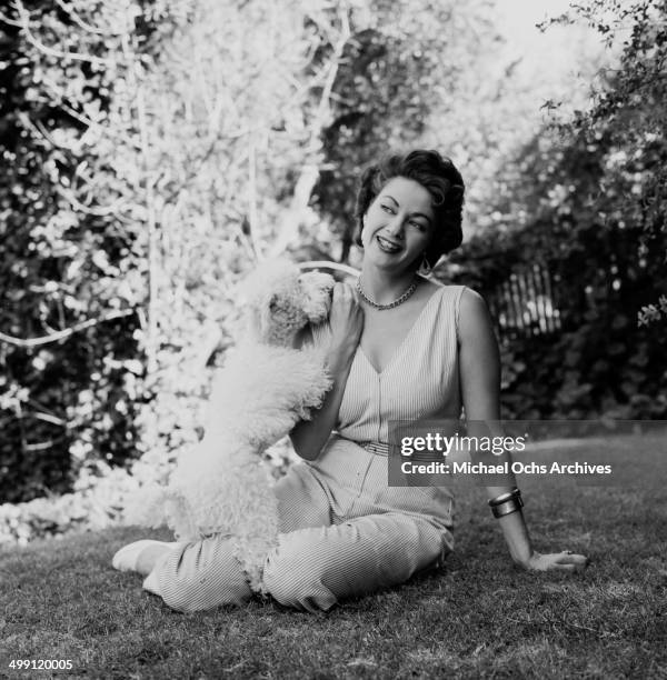 Actress Yvonne De Carlo poses at home in Los Angeles, California.